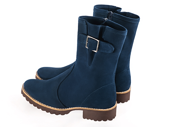 Navy blue women's ankle boots with buckles on the sides. Round toe. Flat rubber soles. Rear view - Florence KOOIJMAN
